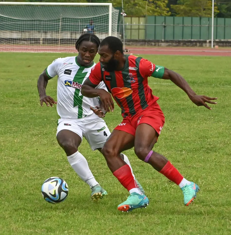 Montego Bay United’s Owayne Gordon (right) takes on Tivoli Gardens FC’s Nathan Thomas during the Jamaica Premier League match at Montego Bay Sports Complex in St James on Sunday April 7, 2024. (Photo: Paul Reid)